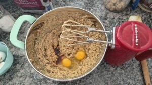 eggs and vanilla extract go into mixing bowl