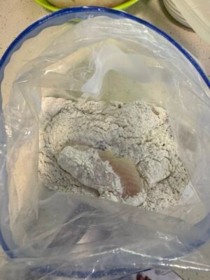fish or chicken pieces coated in seasoned flour