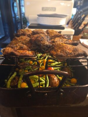 baked chicken with vegetables in baking pan